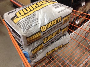 The first three of a gazillion sand bags to fill the run.